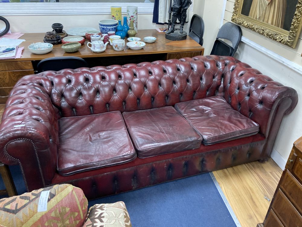 A Victorian style buttoned burgundy leather three seater Chesterfield settee, width 190cm depth 85cm height 72cm